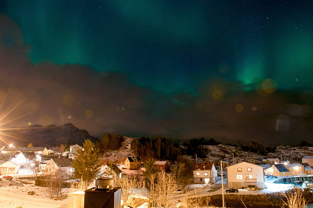 istock Northern Lights Over Snowy Village 2234970036