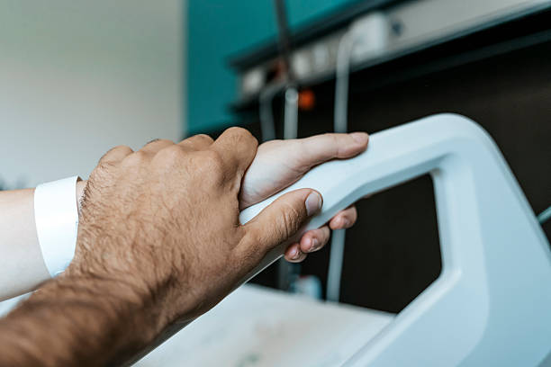 istock Patient Hand in Hospital Bed 2234971418