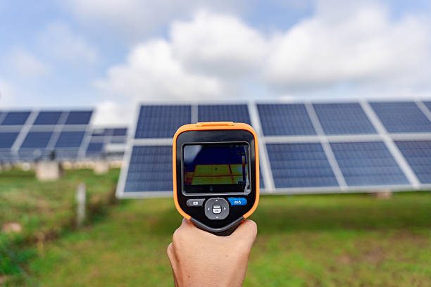 istock Handheld thermal imaging camera inspects solar panel arrays, detecting hotspots and faults for reliable outdoor photovoltaic maintenance 2234973935
