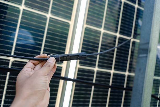 istock Solar panel MC4 connector ensures secure, weather-resistant connection for reliable outdoor photovoltaic installations 2234973943
