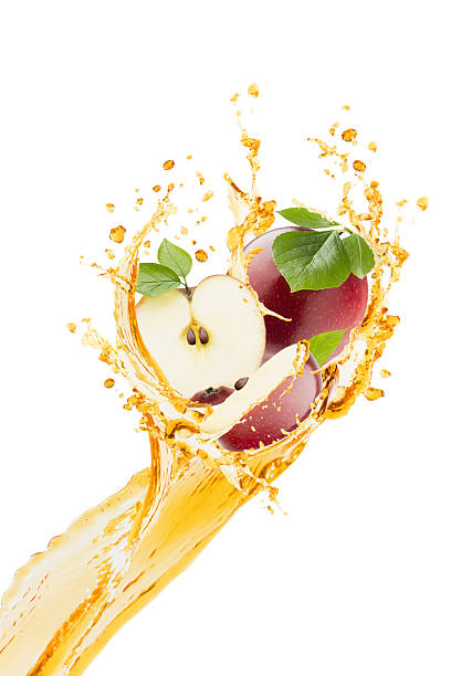 istock Summer refreshing apple juice as levitation flow, isolated. Organic red apple fruit slices, green leaves, drops, splashing in yellow wave. Excellent for drink promotions, nutrition wellness, detox. 2234974420