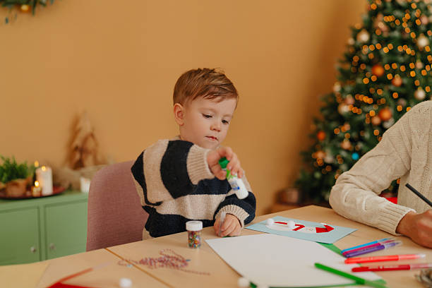 istock Signing Christmas cards together 2234979213