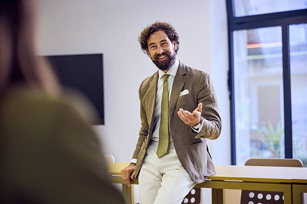 istock Confident Professional Man Leading a Presentation in a Bright Office Setting 2234980099