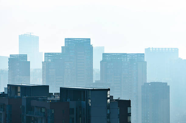 istock modern office building with fog sky 2234984485