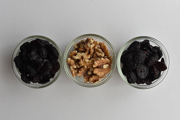 Healthy nuts and dried fruits, close-up of walnuts and cherries