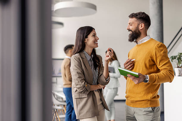 istock Business Professionals Engaging in Conversation in Contemporary Office Environment 2234988579