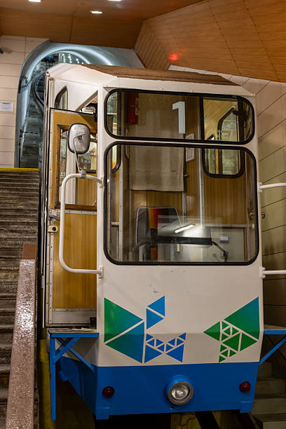 Funicular waiting for the passengers to help them to get on a hill. Tunnel in the background. Karlovy Vary, Czech republic.