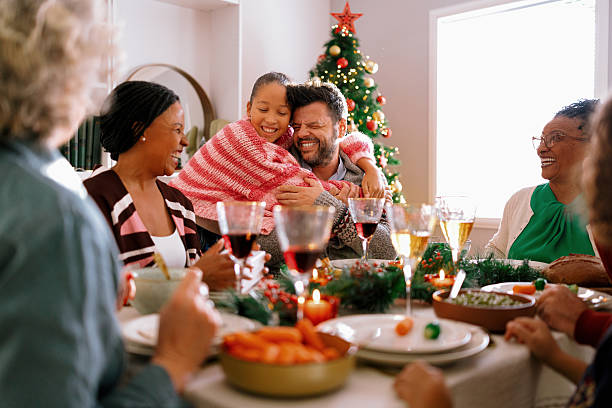 istock Daughter embraces father with joy after opening holiday present. 2234994211