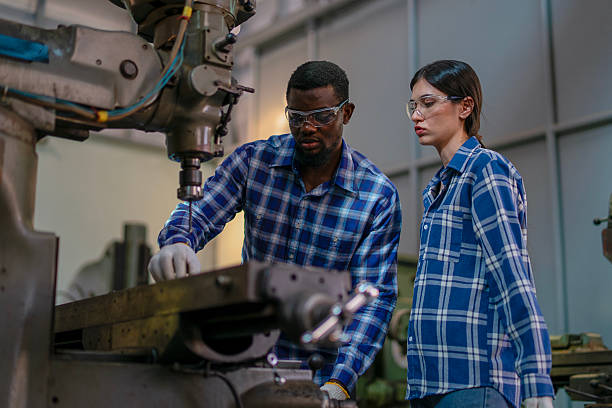 istock Blue collar workers are working at machine shop. 2234996462