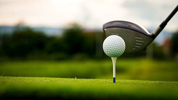 istock Golf ball on green grass in the evening golf course with sunshine background. 2234999569