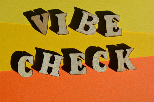 Vibe Check, words in wooden alphabet letters isolated on background as banner headline