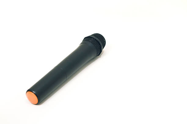 A close-up studio shot of a microphone isolated on a white background