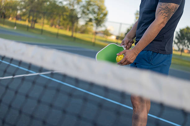 istock An unrecognizable man prepares to serve a pickleball 2235002676