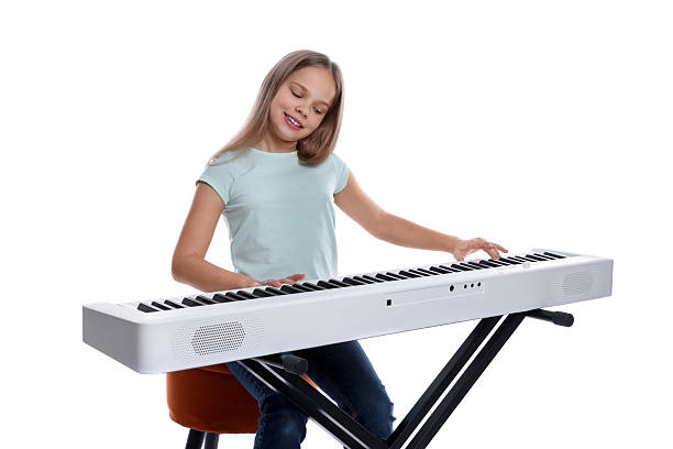 istock Cute girl playing synthesizer on white background 2235005534
