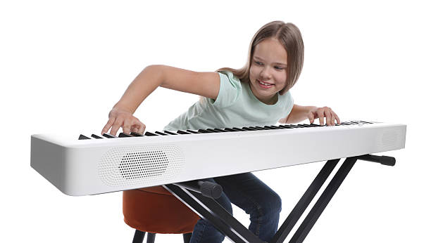 istock Cute girl playing synthesizer on white background 2235005575