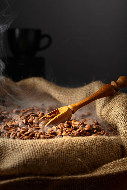istock Fresh roasted coffee beans in burlap bag. 2235007645