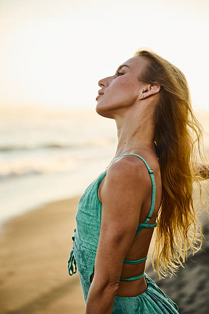 istock A serene moment by the beach at sunset with golden light 2235010729
