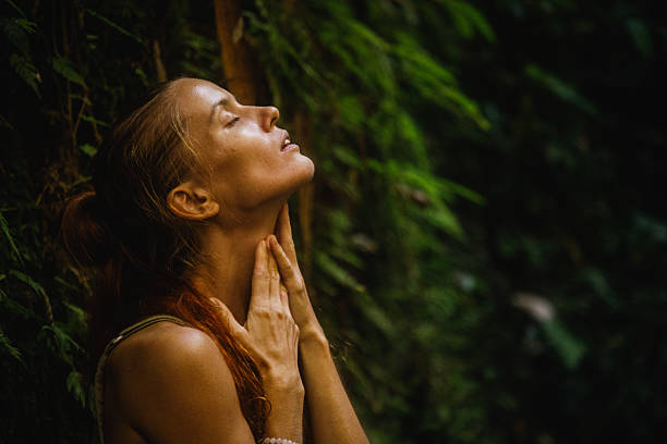 istock Serene woman enjoying nature in a lush green forest setting 2235012012