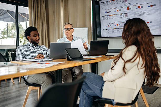 istock Small group of people having a business meeting using laptops 2235012619