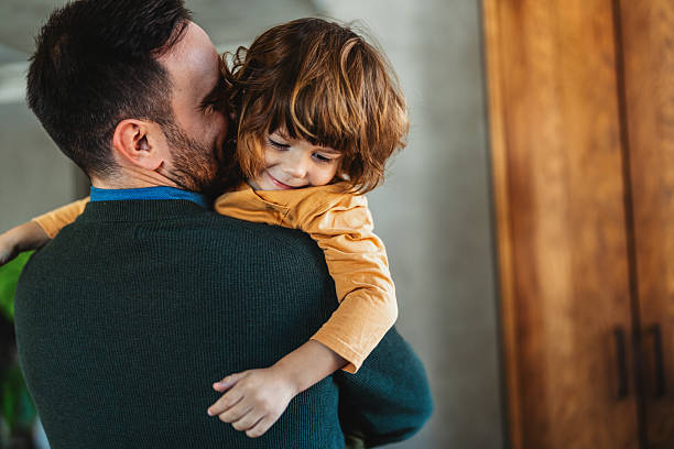 istock Happy loving daddy and affectionate boy playing, laughing having fun at home. Family leisure concept 2235013410