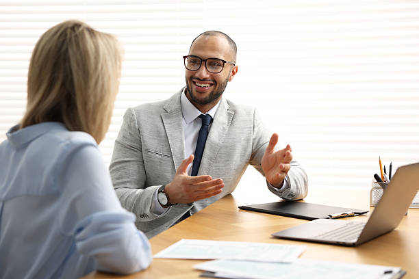 istock Coworkers working together at table in office 2235013780