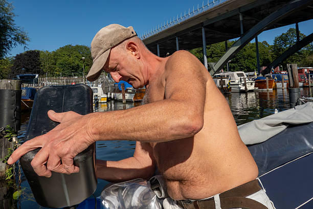 Man on a boat at the Intracoastal Waterway in Fort Lauderdale, Florida, USA