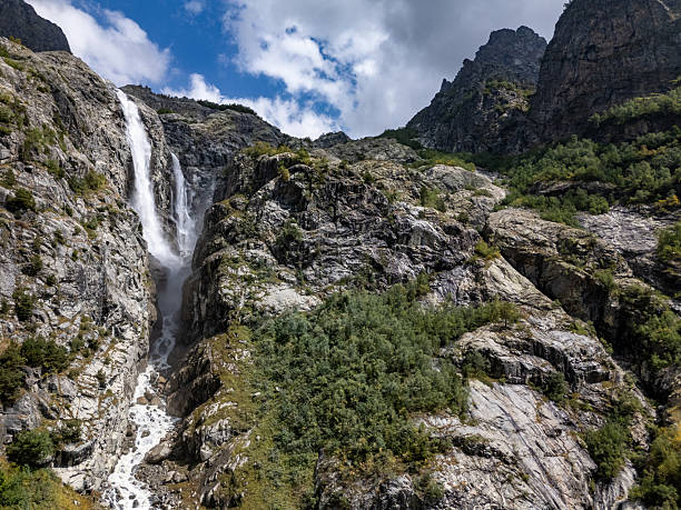 istock Waterfall cascading down rocky mountain in Mestia, Svaneti, Georgia 2235016112