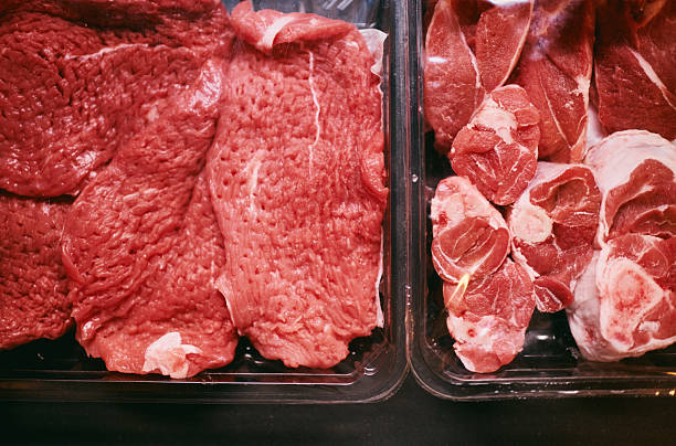 istock Freshly Cut Beef Slices and Marbled Meat in Plastic Trays 2235018435