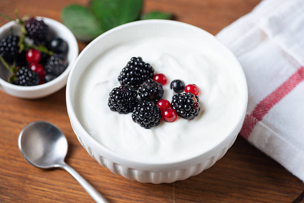 istock Greek yogurt with blackberries and currants 2235025734