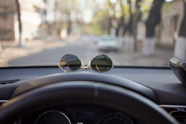 istock Sun glasses in the car. 2235027084