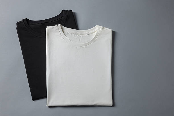 istock Different blank t-shirts on grey background, top view. Mockup for design 2235031863