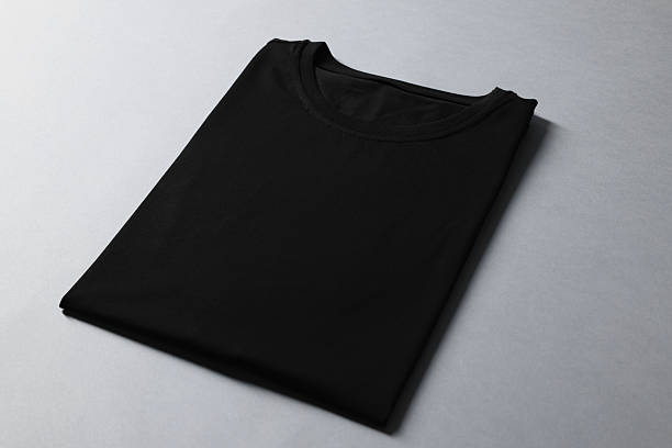 istock Blank black t-shirt on grey background. Mockup for design 2235031983
