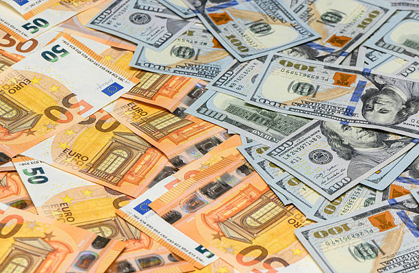 istock US dollar and euro notes background with cryptocurrency finance theme 2235034128
