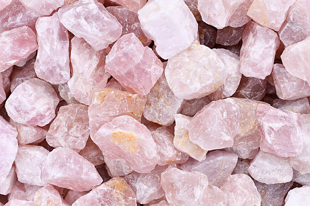 istock Close up of raw large rose quartz crystals. 2235034152