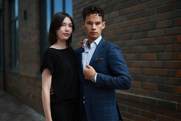 istock Elegant young Couple Posing Near Brick Building 2235035230