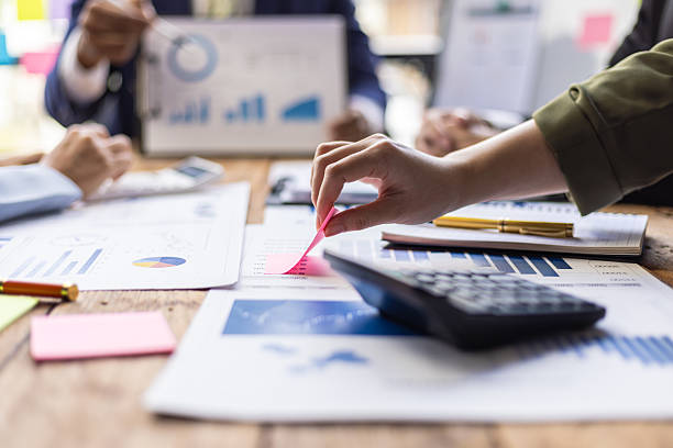 istock Business people are discussing company performance and analyzing charts and graphs showing positive growth during a corporate meeting. 2235036529