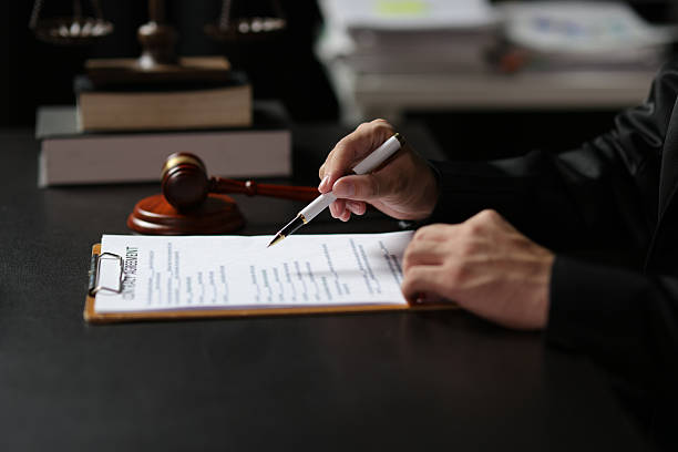 istock Lawyers are reading documents and writing, signing contract agreements. 2235037120