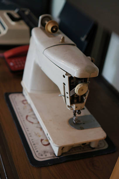istock Vintage Sewing Machine on a wooden table 2235037134
