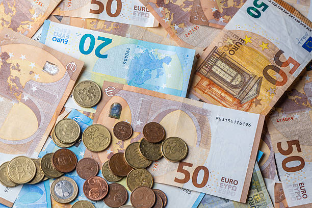 istock Euro currency background with banknotes and coins 2235037265
