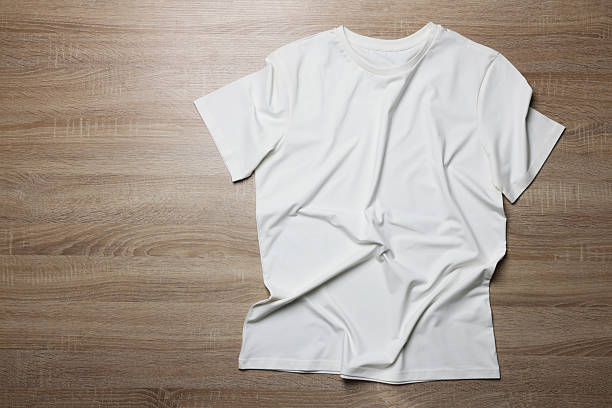 istock One t-shirt on wooden background, top view. Space for text 2235039108