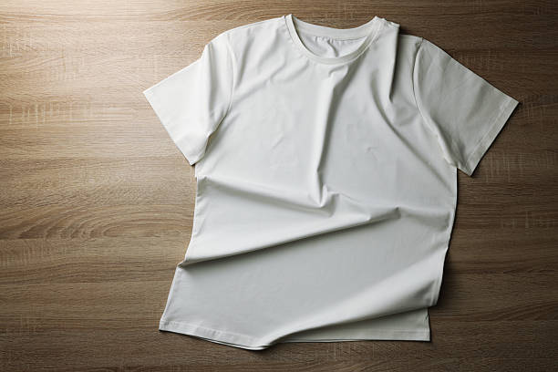 istock One t-shirt on wooden background, top view. Space for text 2235039608