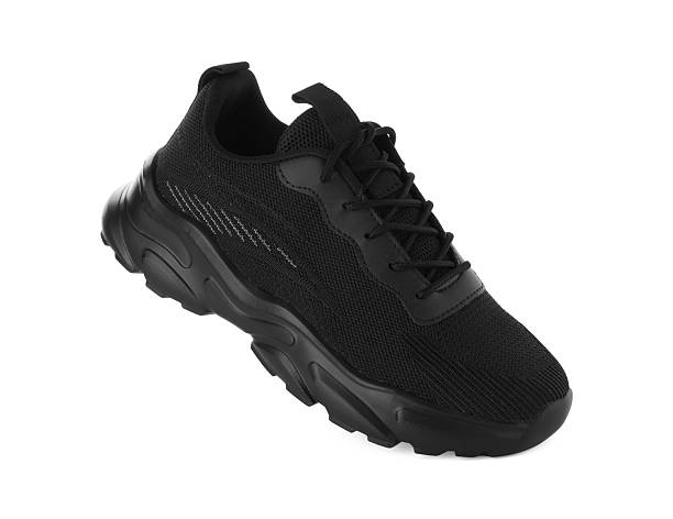 istock One black sneaker in air isolated on white 2235040517
