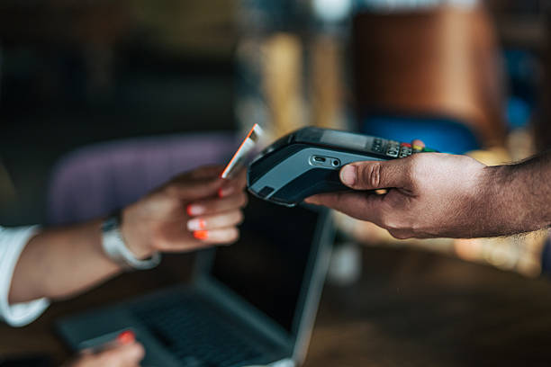 istock Customer paying with contactless credit card at cafe 2235041172