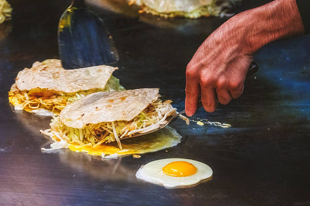 istock A chef makes Hiroshima style Okonomiyaki in Hiroshima, Japan. 2235041602