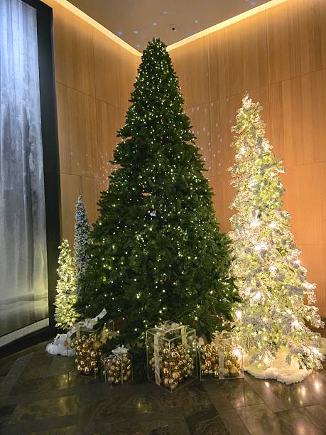istock Elegant Indoor Christmas Tree Display with Golden Ornaments 2235042709