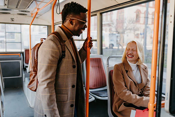 istock Young professionals laughing together while riding public transport 2235047701