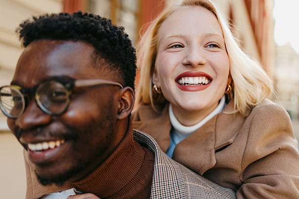 istock Young multi-ethnic couple having fun together outdoors 2235048478