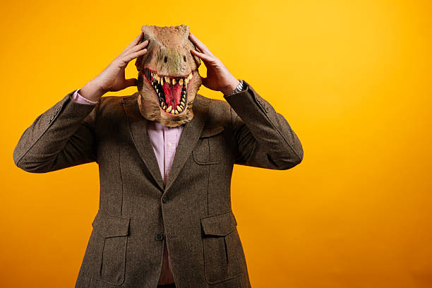 istock Dinosaur head businessman pointing sideways 2235048761