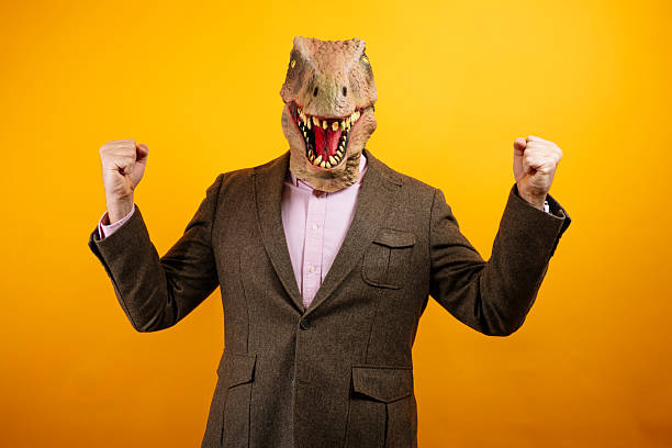 istock Dinosaur masked man holding his head 2235048763