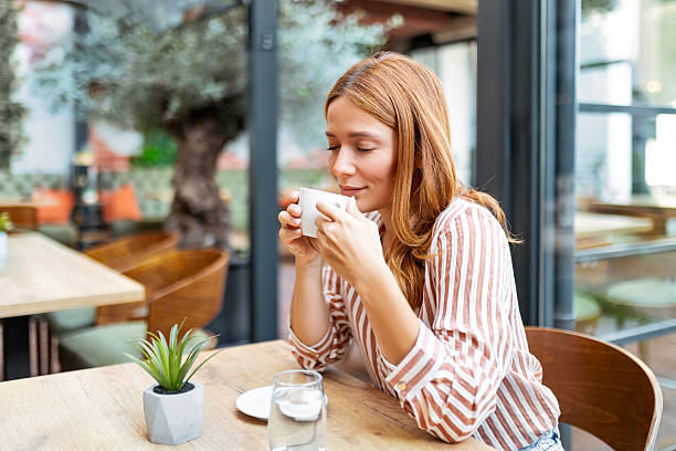 istock Young woman spending time in coffeehouse 2235049804